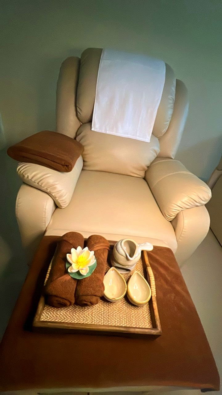 Spa pedicure lounge with lotus and towels
